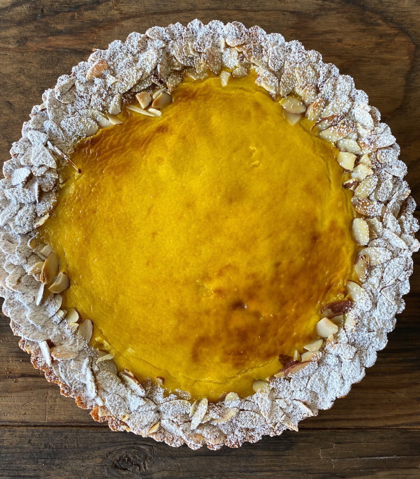 Whole almond tart with passionfruit crème and sliced-almond crust